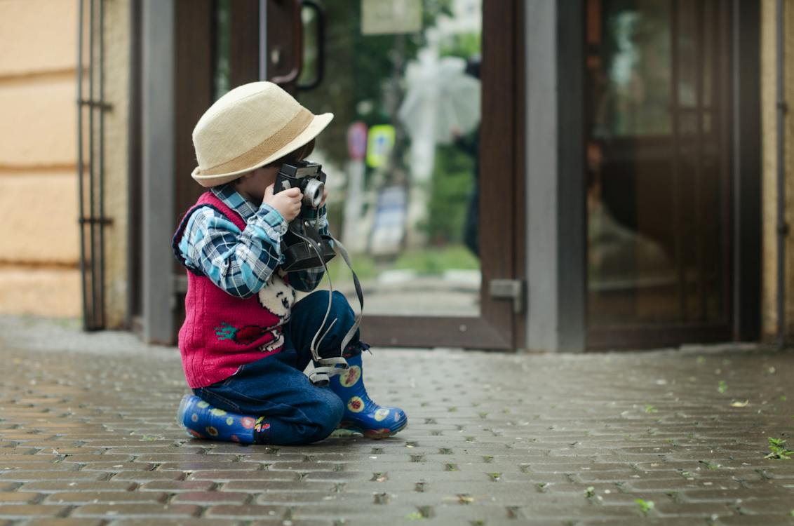 Free Boy Taking a Photo Using Camera Stock Photo